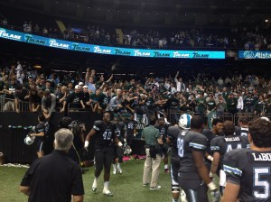 Tulane players celebrating with the student section